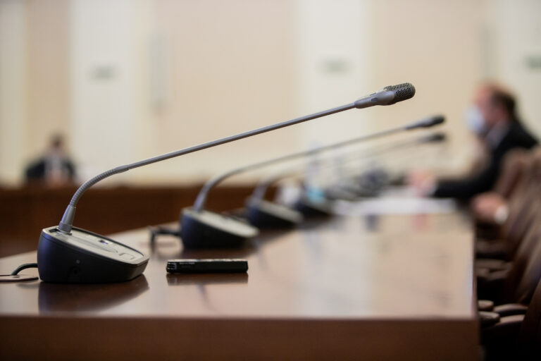 Microphones on a government hearing dais