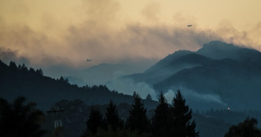 Air tankers fly over smoky ridgelines of the Mayacamas Mountains during the 2017 Nuns Fire.